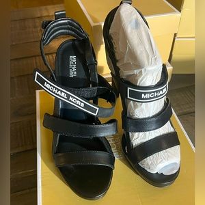 Michael Kors black leather sandal.